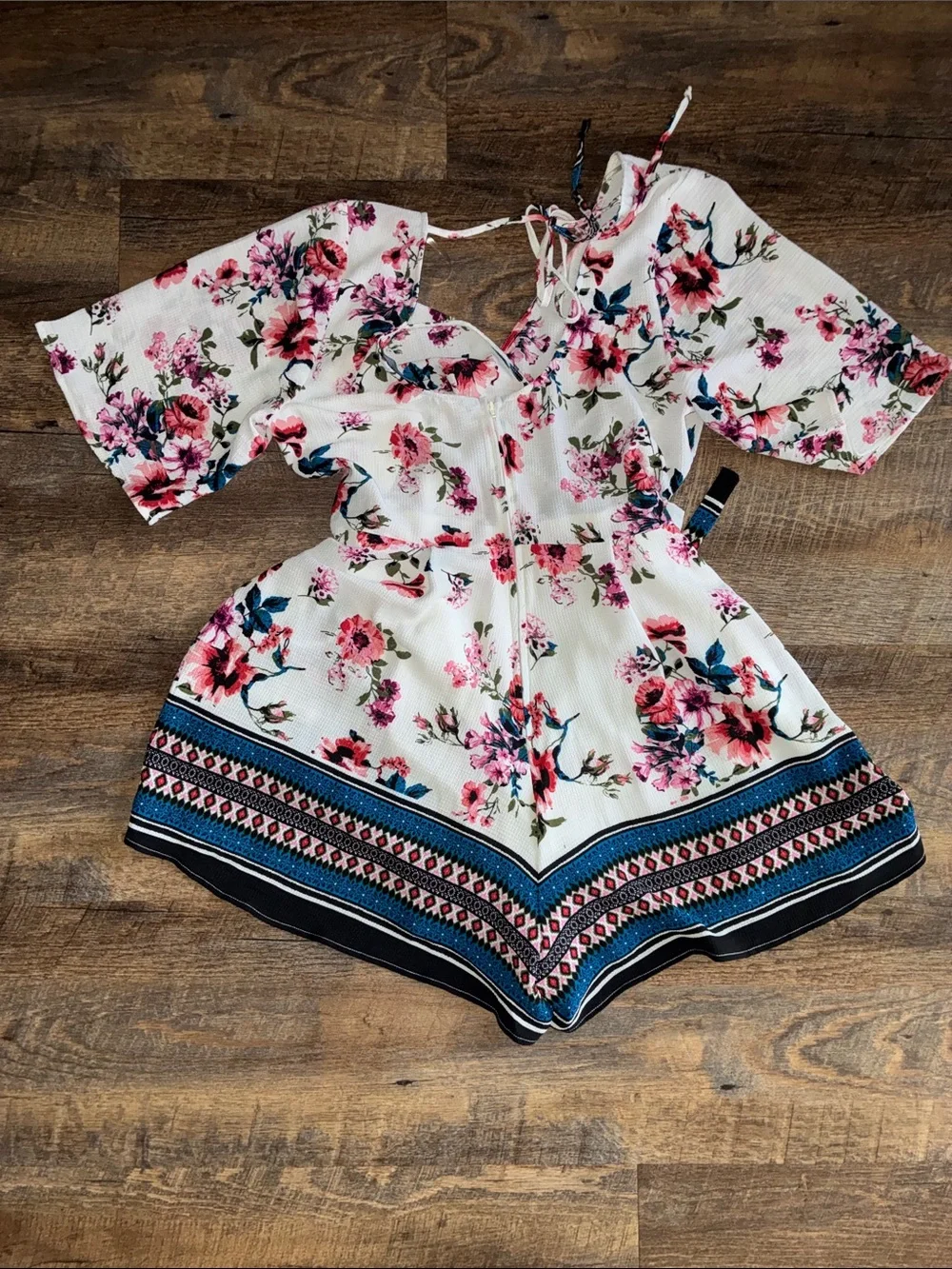 Francesca's Collections White Floral Romper with Pink & Blue Accents
